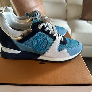Blue, Navy, and White suede with gold detail Louis Vuitton sneaker. Size 8.